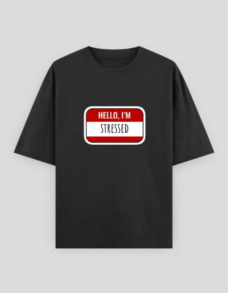 Black t-shirt with Hello I'm Stressed printed in a name tag design for casual wear